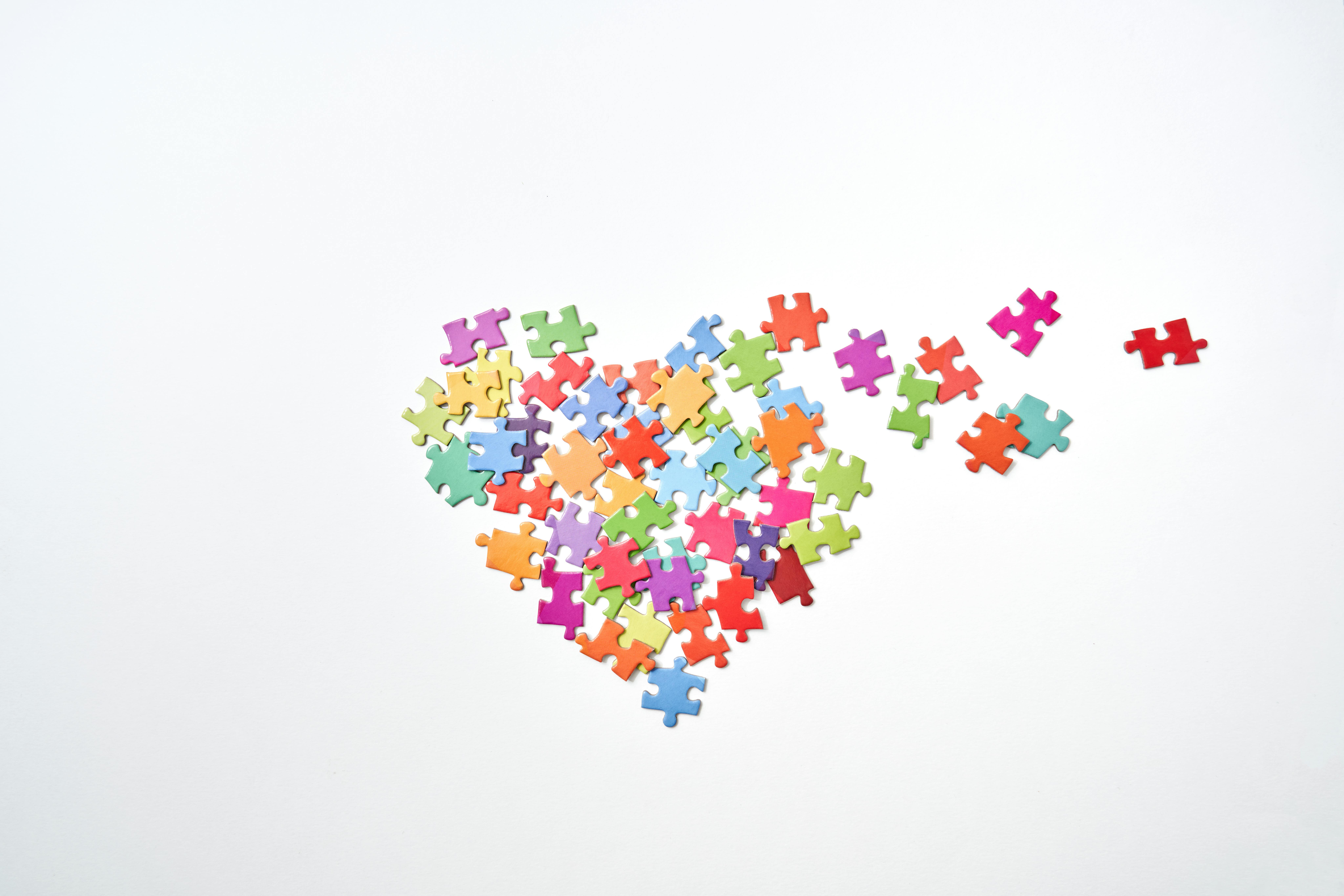 Broken Heart Shaped Puzzle Pieces in White Background