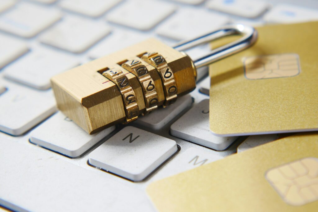 Lock on computer with credit cards.