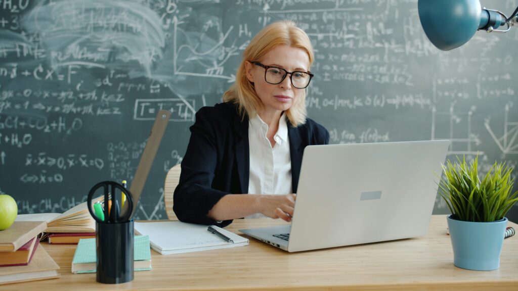 Teacher at desk on her computer