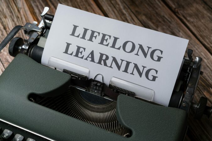 Typewriter with the words lifelong learning on paper.